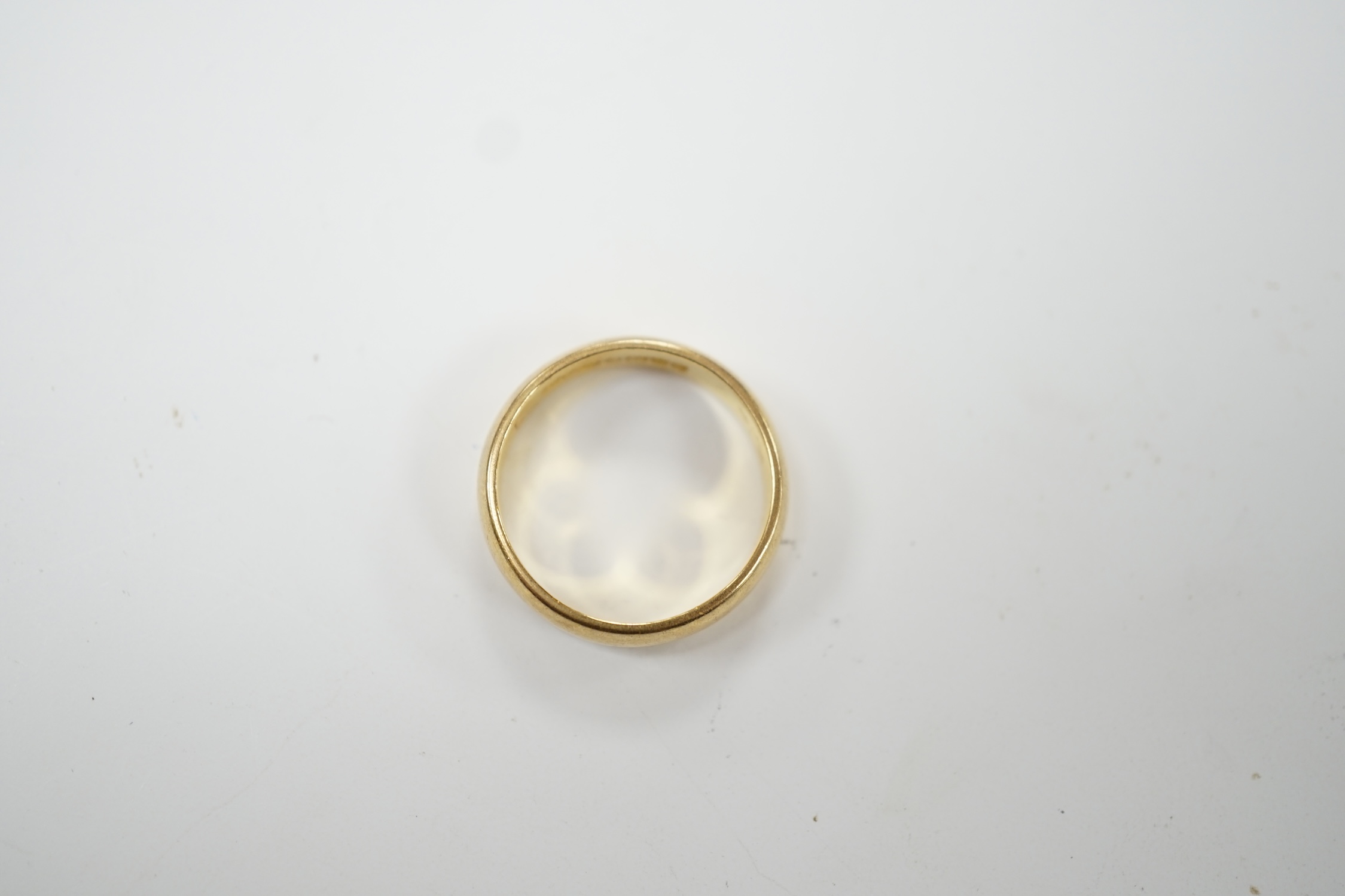 A 22ct gold wedding band, size K/L, 5 grams. Fair condition.